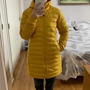 Lolë yellow packable down jacket, size small.